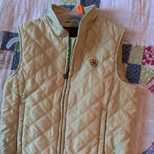 Ariat Black Label with Orange Text on tapered vest.